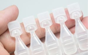 A row of artificial tear containers used to treat dry eye