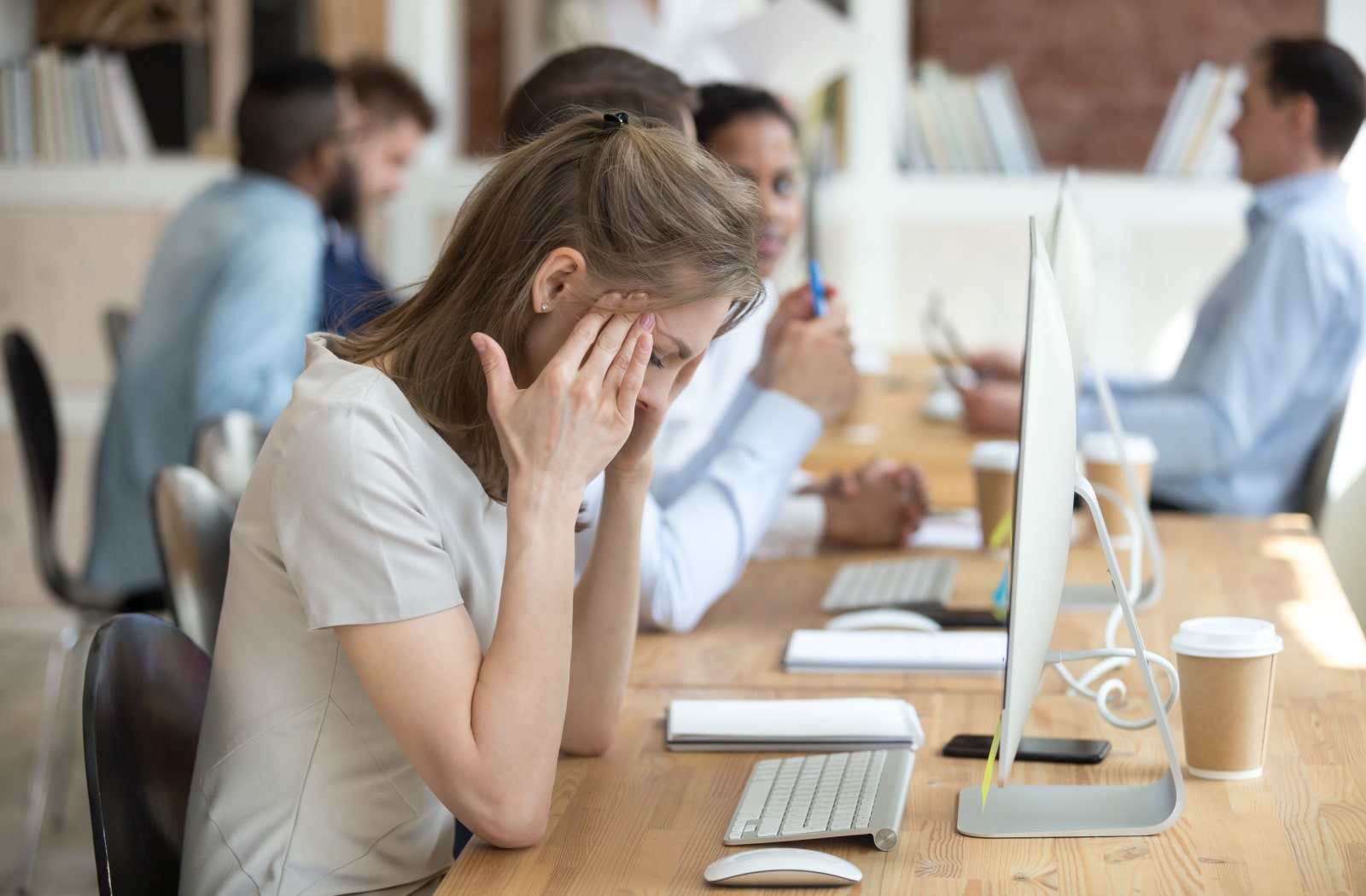 Young professional having a head ache after hours of computer screen exposure