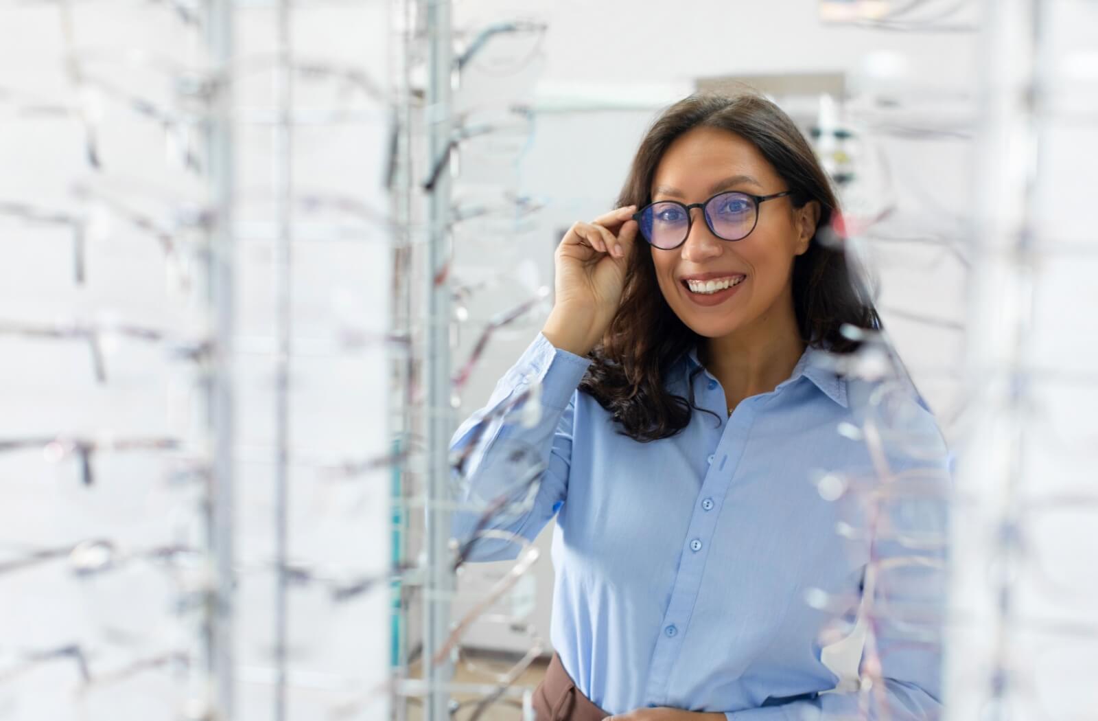 A person trying on new glasses at an optometrist's office.